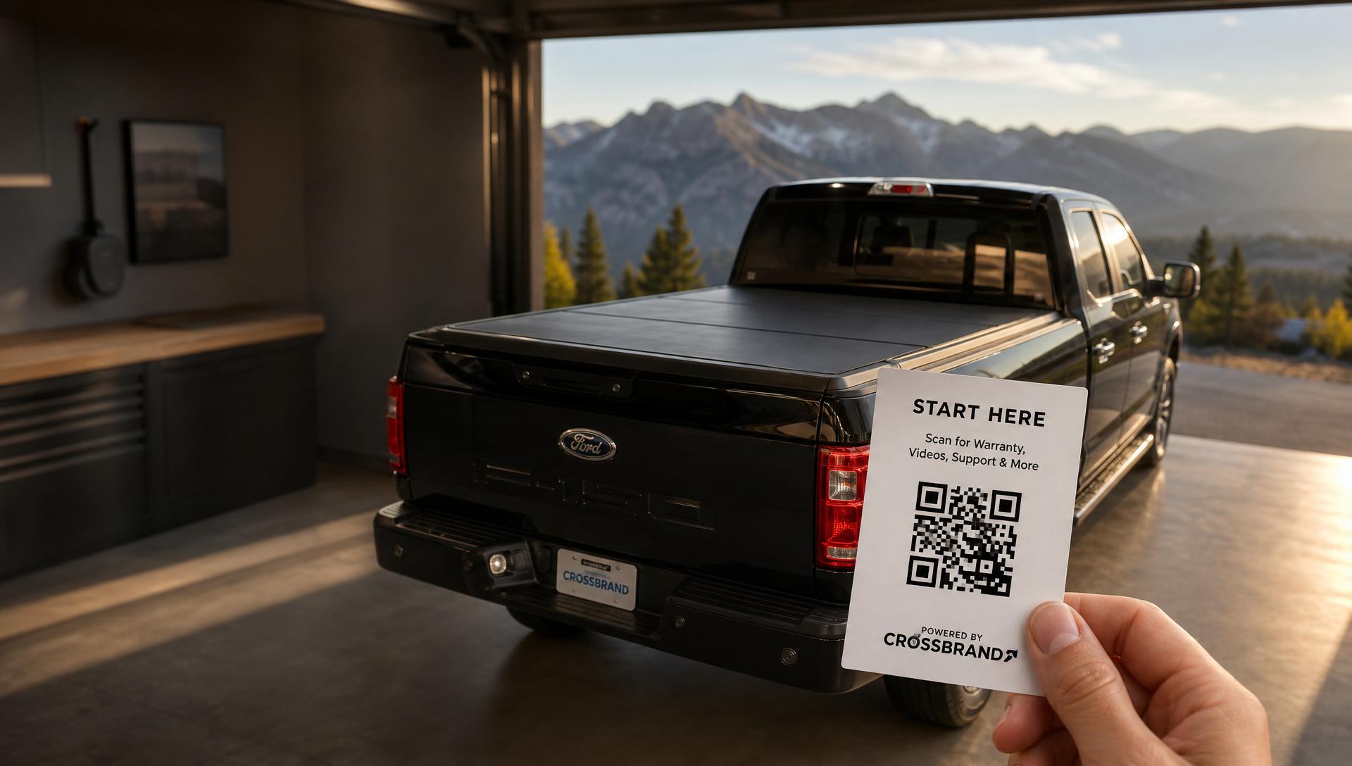 F-150 in a modern garage with mountain view, customer holding a Start Here card